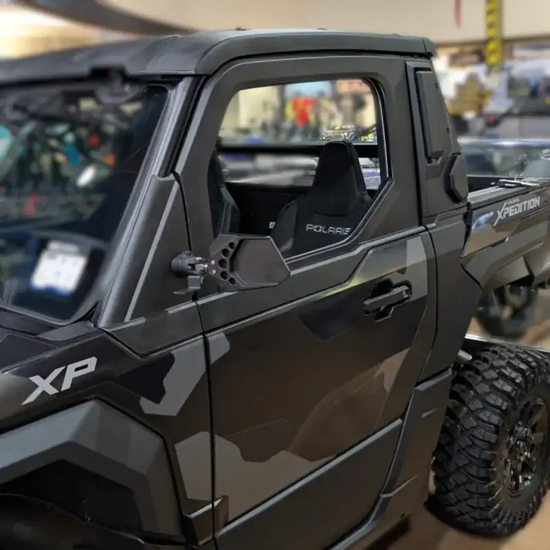 Polaris Xpedition mirror with pod light mount on a Polaris Xpedition