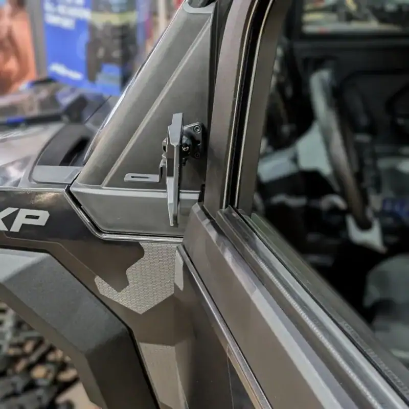 Polaris Xpedition mirror with pod light mount on a Polaris Xpedition