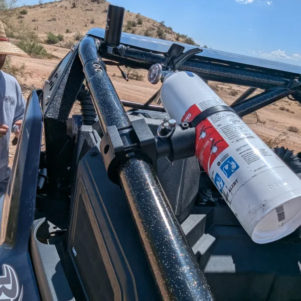 Best UTV fire extinguisher mount with quick release and 360° adjustability, shown mounted on a Polaris RZR Pro R with First Alert MARINE1