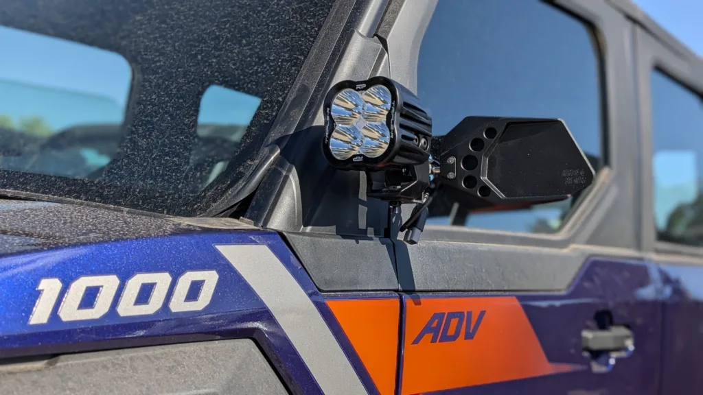 Polaris Xpedition with IronSight Series billet mirror and integrated pod light mount installed on A-pillar