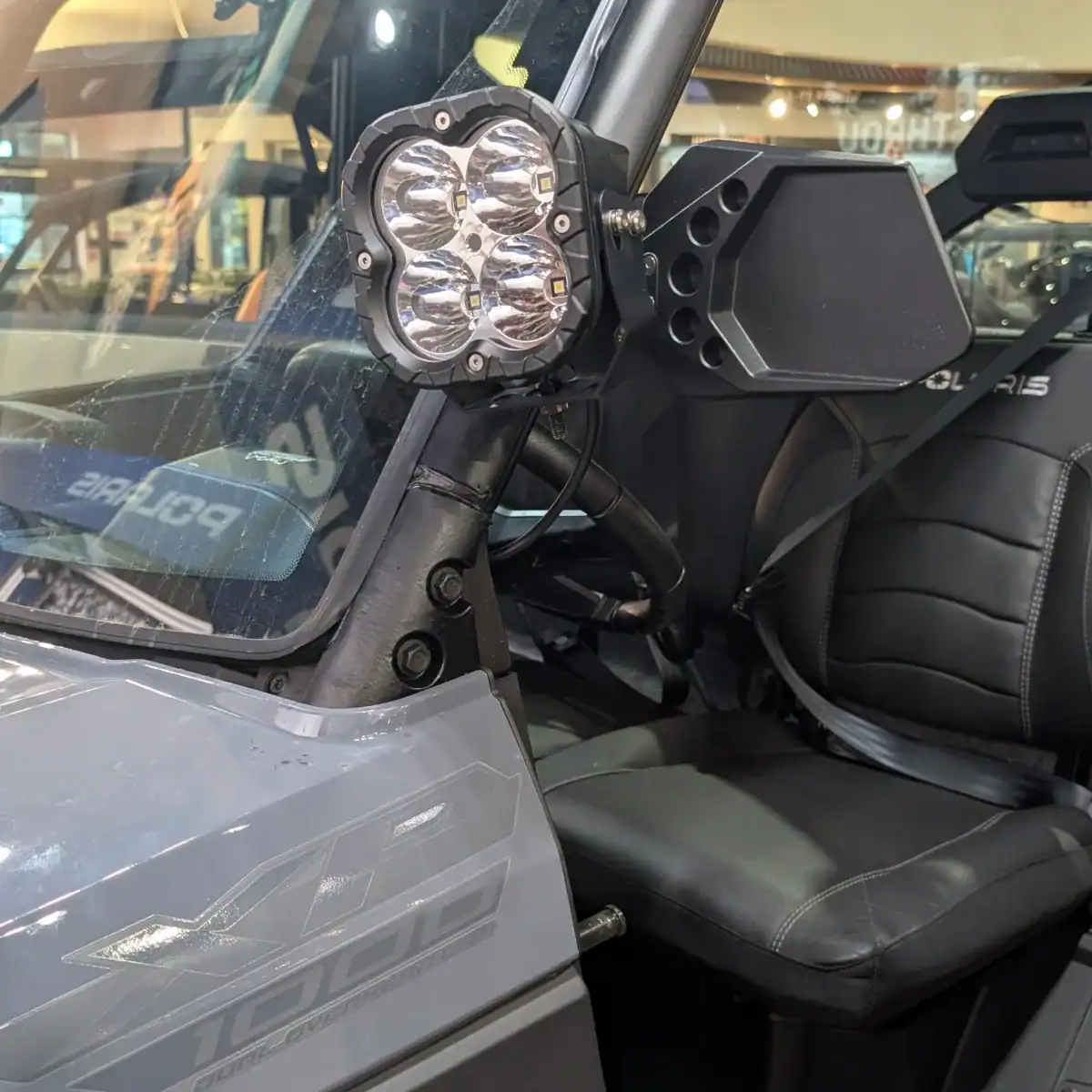 Polaris XP 1000 billet side mirror with pod light showing compatibilit with tip out Polaris windshield