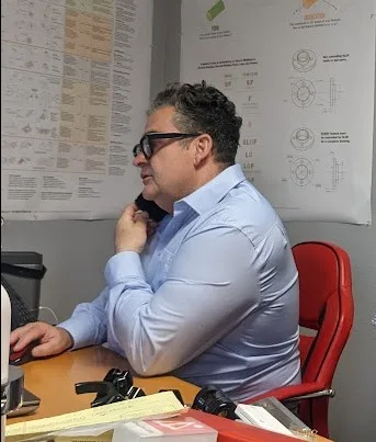 Rikki Battistini reviewing product development and engineering concepts for Dirtbag Brands