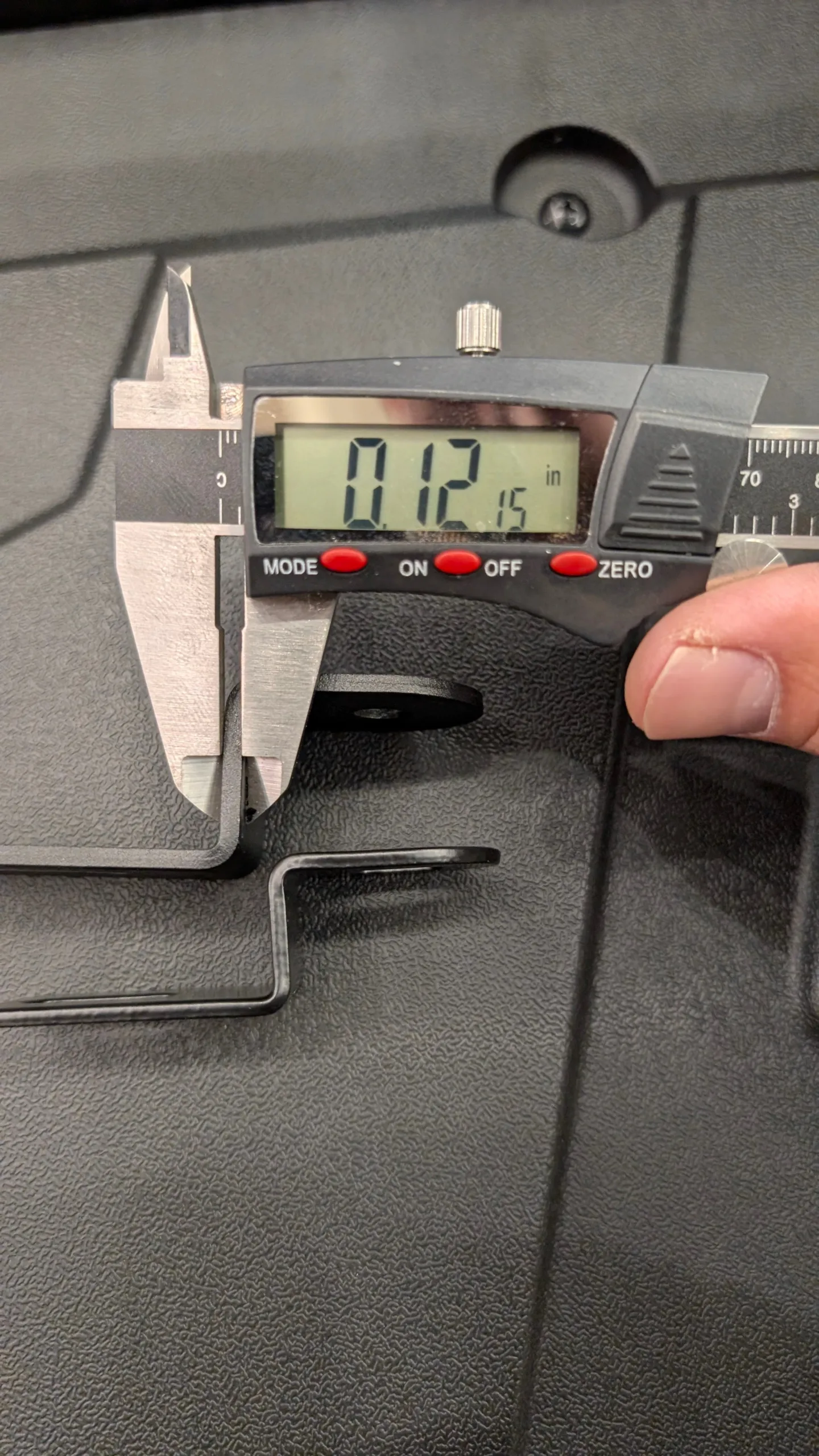 caliper measurement of Dirtbag Brands pod light bracket for mirror