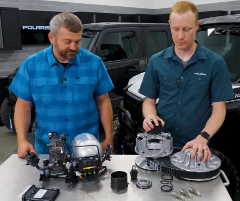 Polaris engineers demonstrating the 2027 XPEDITION NUMATIX controlled CVT transmission and pneumatic clutch components