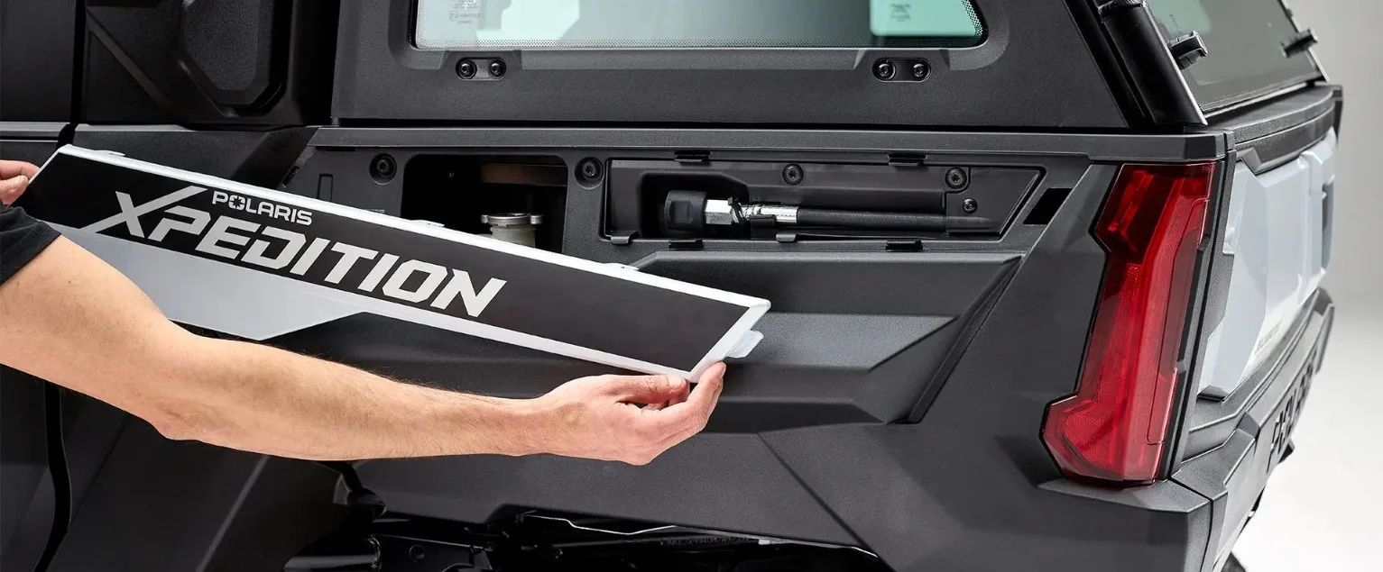 2027 Polaris XPEDITION onboard exterior storage compartment with integrated onboard air system access